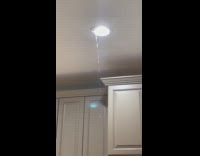 Hot water leaking through ceiling light