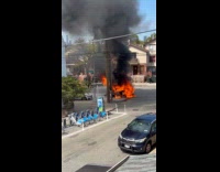 Car on the street engulfed with flames