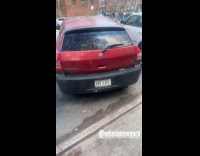 Parked red car EBT LIFE license plate