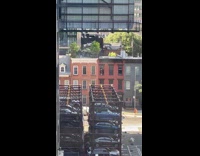 Collab WINY - Man hold onto the window and clean it