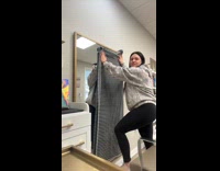 Girl covers mirror confused