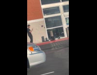 Man with cap poses outside Best Buy