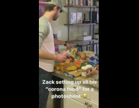 Guy arranges snacks corona photoshoot gold hat