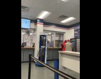 Collab WINY - Woman red jacket play music in post office