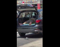 Man sleep inside car parked on street