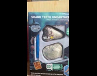 Shark with human teeth on  product box