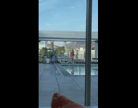 Woman purple shorts dance twerk rooftop pool