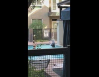 Guy suit and tie under pool waterfalls 