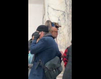 Man carry dog on shoulders at exhibit