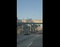 Band singer and keyboard over bridge cars
