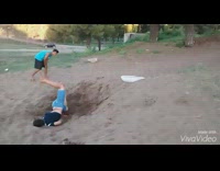 Boy backflips off white bag and scorpions into dirt ground, dubstep music