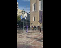 Man hold purple jacket pose outside church