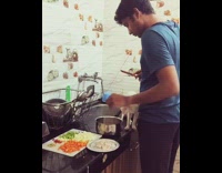 White cat kitchen counter guy cuts