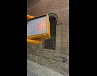 pedestrian signs upside down on pole