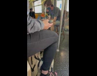 Guy sits on wooden chair on subway