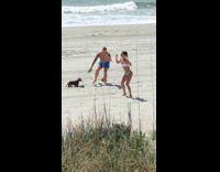 Woman bikini squat workout video beach dog