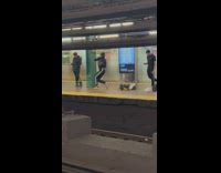 Feminine Man Boldly Dances on Subway Platform