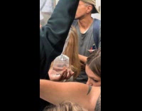 Collab Subway Creatures - Man holds goldfish in plastic at train