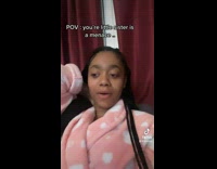 Lady Smiles as she Looks at Toddler Sister 