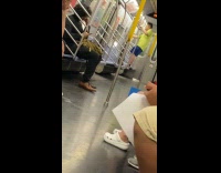 Collab WINY - Guy green shirt stand on train seats