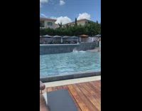 Woman black bikini dramatic dance swimming pool