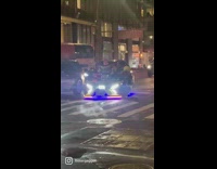Person in Costume Waves Hand from Customized Cart