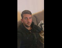 Guy on couch with cat on lap 