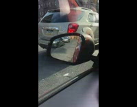 Sticker sign on car that says kids up in this bitch