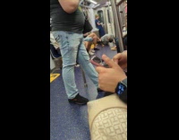 Man doing push ups inside subway train
