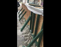 Subway station stairs entrance flooded with water blocked by wooden walls