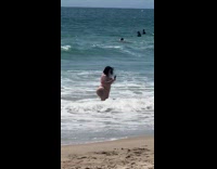 Woman bikini large butt selfie at beach