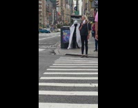 Guy white cape black pants sidewalk crosswalk 