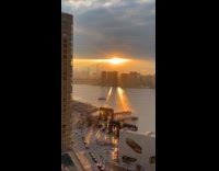 Sunset light on river divided by buildings shadow