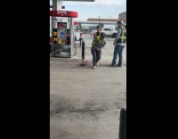 Man fail skateboard trick at gas station