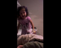 Young girl minnie shirt dance while parents sing