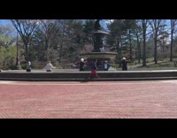 Five ladies dance inside empty water fountain