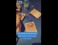 Guy controls light switch on phone bedroom 