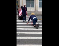 Woman on protest pulls Trump like dog