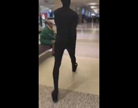 Guy in all black suit runs into department store and tackles mannequins  