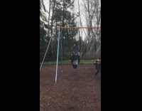 Little boy swing back flip lands on butt