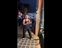 Collab WINY - Man films video use tripod on sidewalk