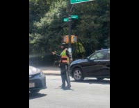 Man wear slippers act as traffic enforcer