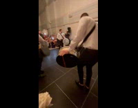 Married couple enters the hall and band plays intruments