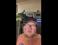 Guy shows his double chin 