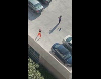 orange pants bandana girl dances rooftop parking 