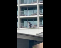 Collab IITW - Woman white top TikTok dance at balcony