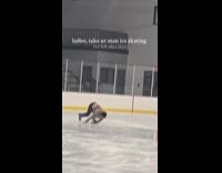 Man slips on ice rink slow motion