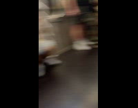 Person wearing wig covers body at subway