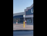 Woman laughs for video at parking lot