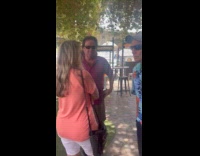 Woman white bikini pose beside fence table